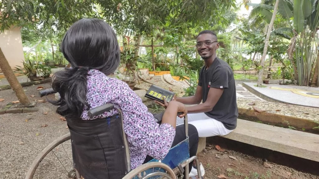 enoque with his disabled beneficiary