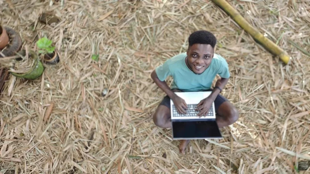 Jethro working on a laptop